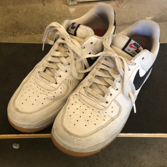 nike air force 1 sneakers with navy swoosh and gum sole